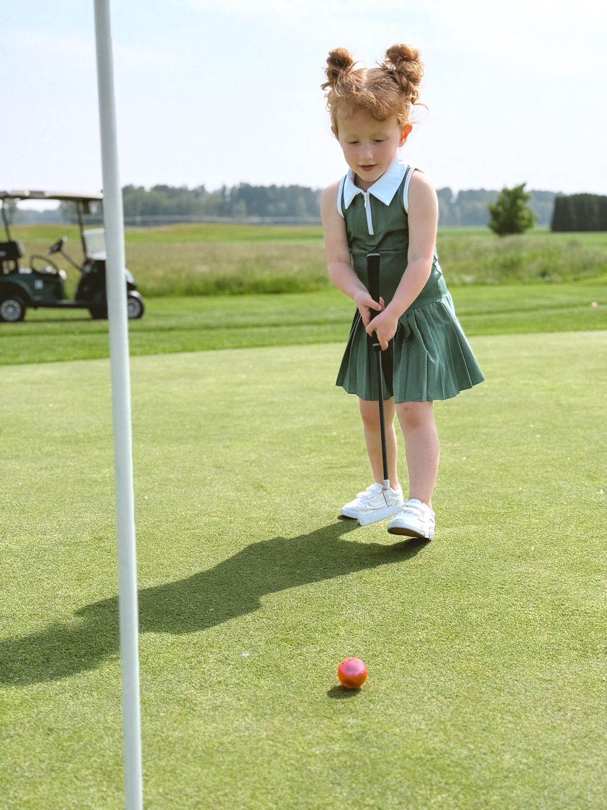 Child Putting Golf Ball with Drake & Birdie Toddler Putter