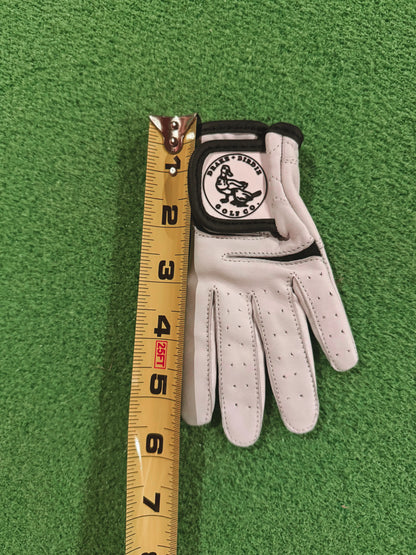 Golf glove with a measuring tape for size on a green background