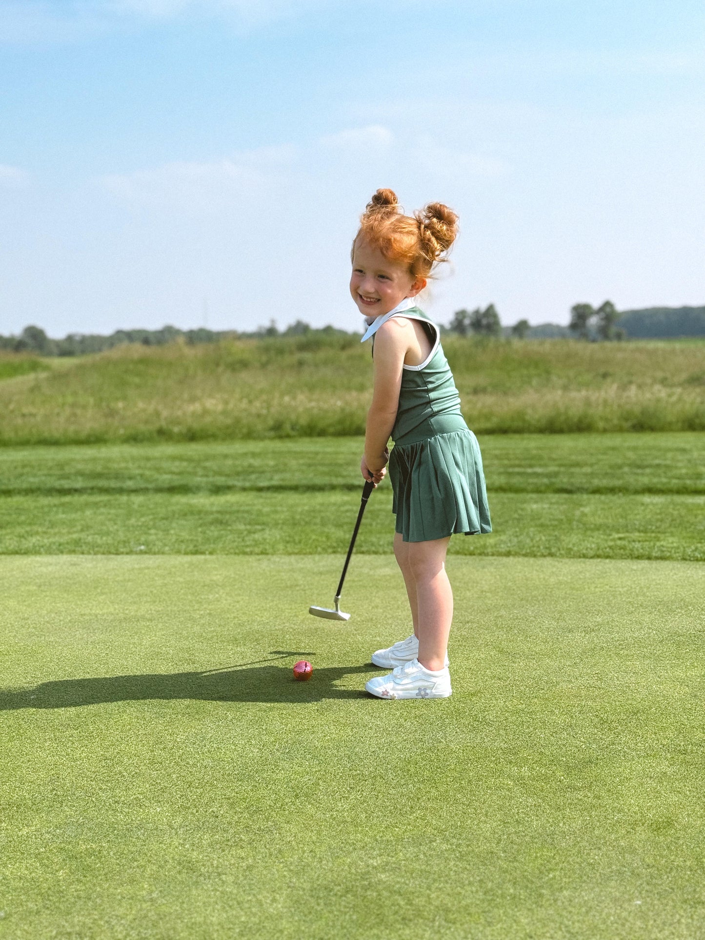 toddler putting on green 