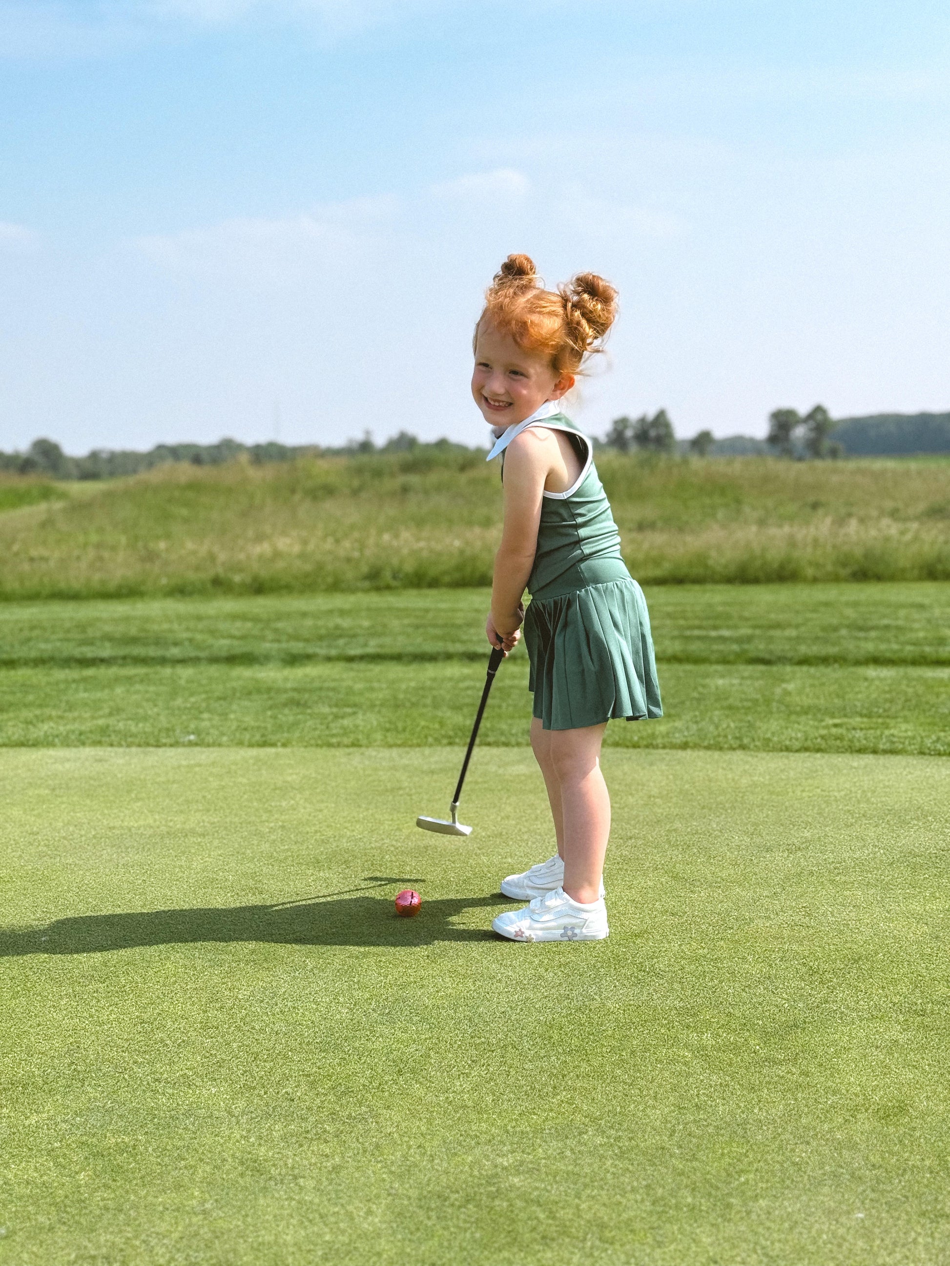 toddler putting on green 