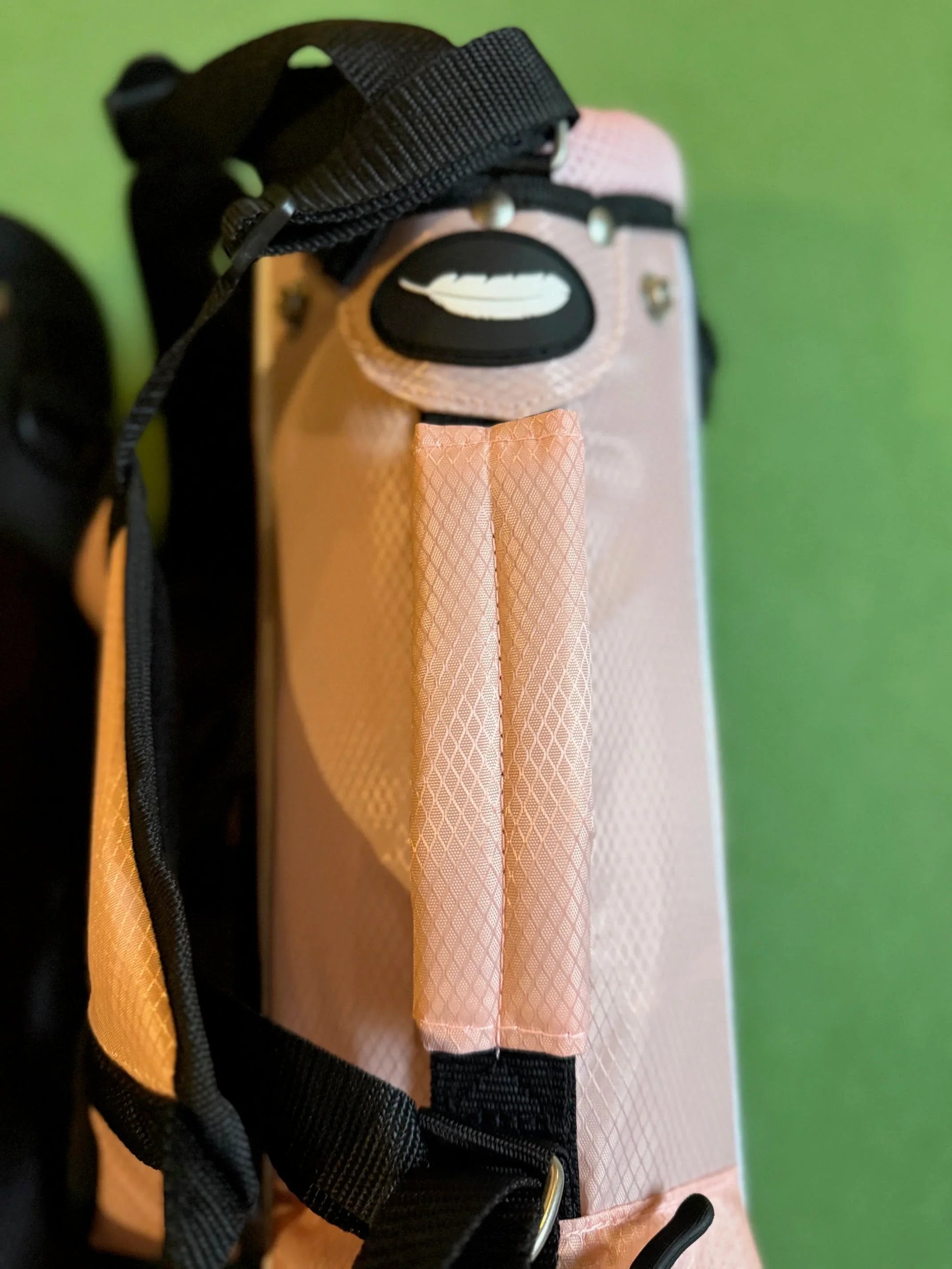 Close-up of a pink toddler golf bag handle 