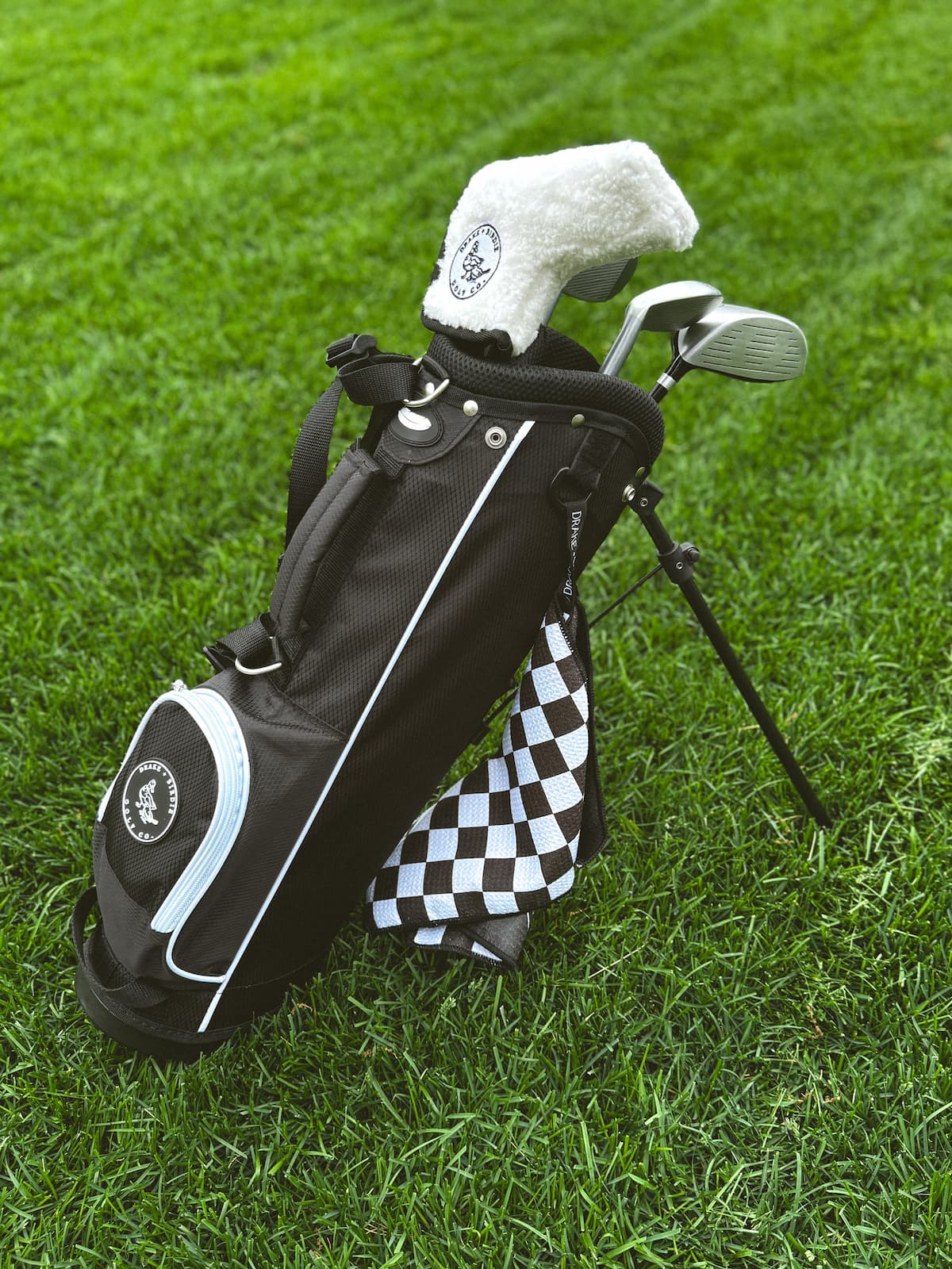 toddler golf bag with stand deployed on course ages 2 to 5